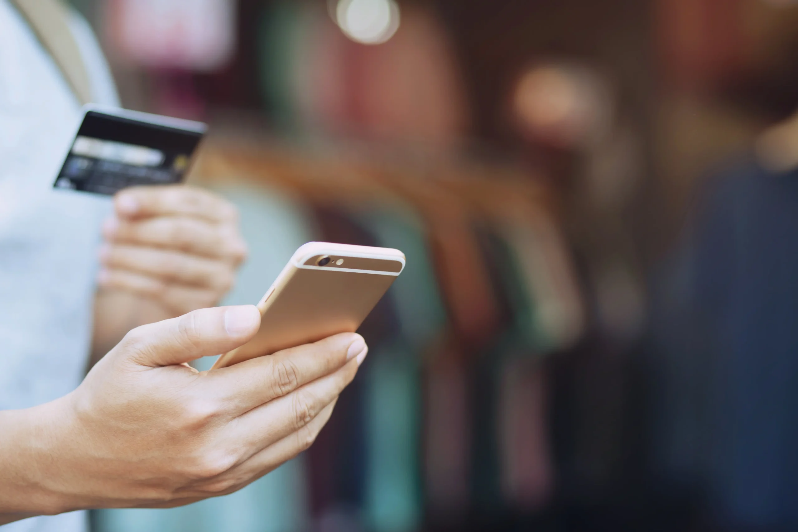 CBE Customer Solutions - Payer with Card and Phone iStock 1133552229
